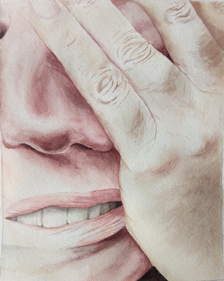 a hand touching the face in an expression of exasperation
